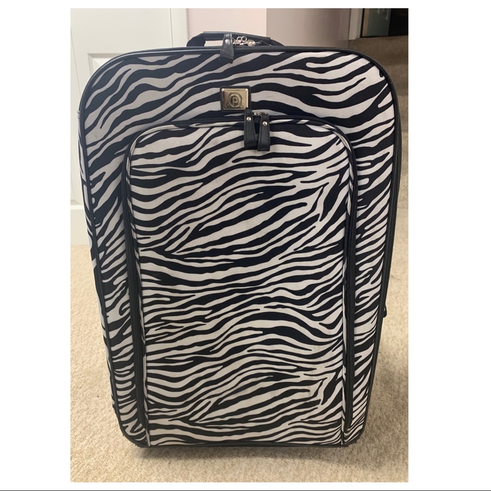Used zebra rolling suitcase 26 inches.